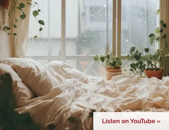 bed scruffled with white sheets and pillows duringa rainy morning